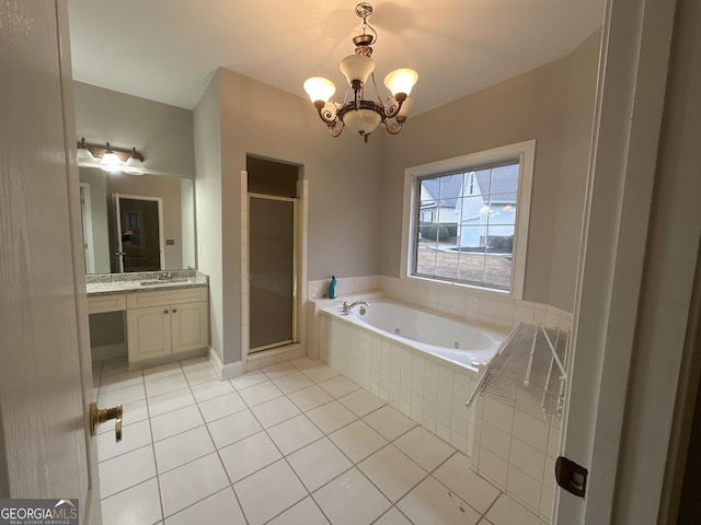 bathroom with an inviting chandelier, vanity, shower with separate bathtub, and tile patterned flooring