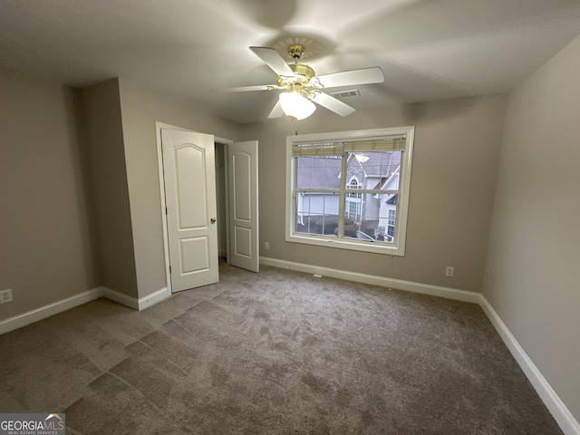 unfurnished bedroom featuring carpet flooring and ceiling fan