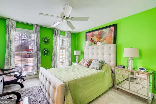 bedroom featuring light carpet and ceiling fan