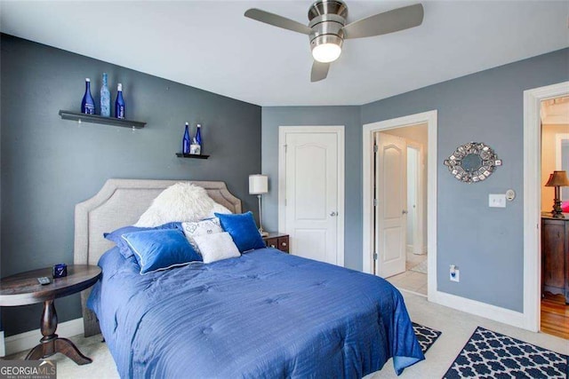 bedroom featuring connected bathroom and ceiling fan