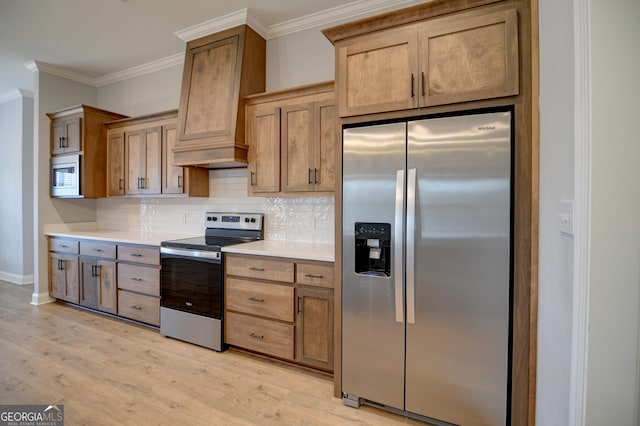 kitchen featuring custom exhaust hood, ornamental molding, appliances with stainless steel finishes, light hardwood / wood-style floors, and decorative backsplash