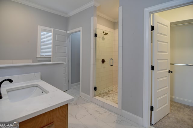 bathroom featuring ornamental molding, a shower with shower door, and vanity
