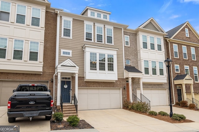 multi unit property featuring a garage