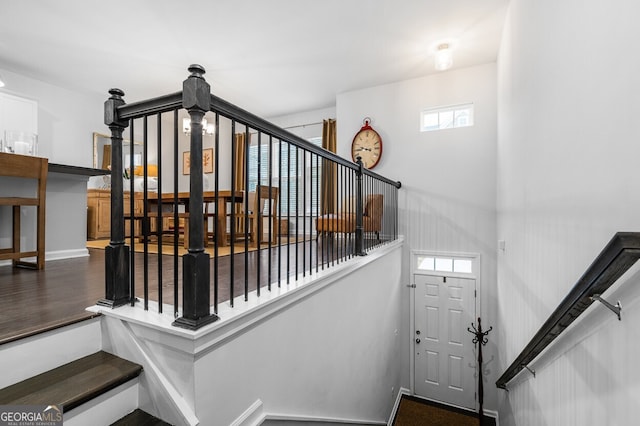 stairway featuring hardwood / wood-style floors