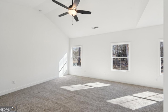 carpeted empty room featuring lofted ceiling and ceiling fan