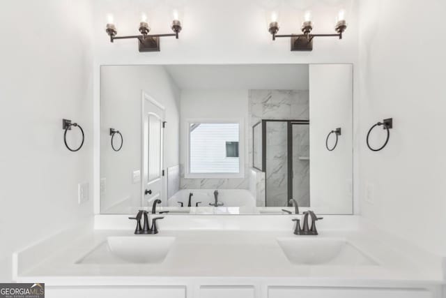 bathroom featuring an enclosed shower and vanity