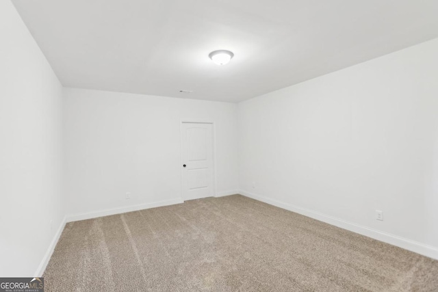 unfurnished room featuring carpet flooring