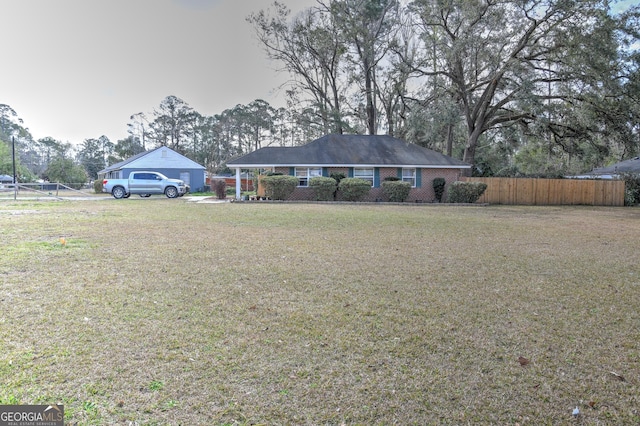 ranch-style house with a front lawn