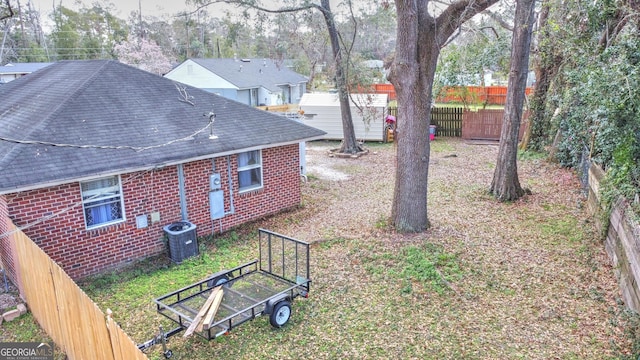 view of yard featuring central AC unit