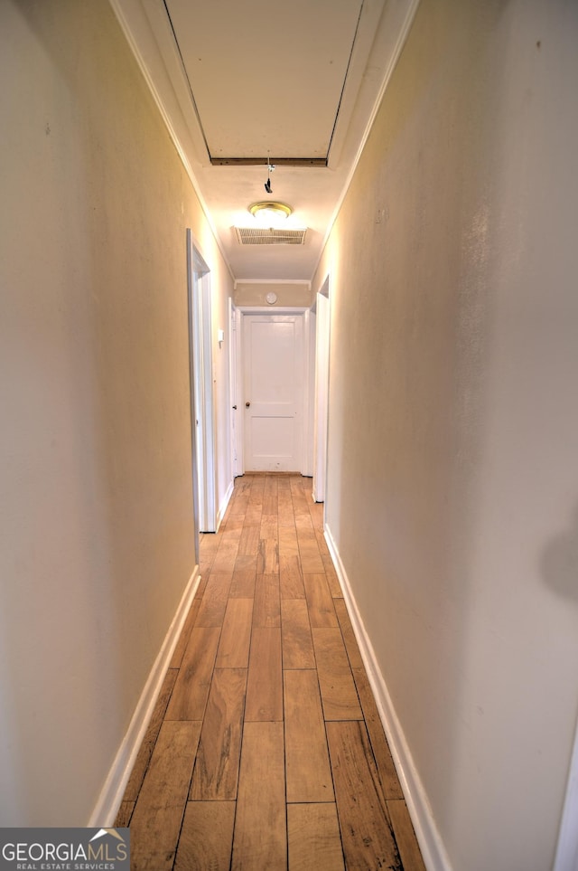 hallway with light wood-type flooring