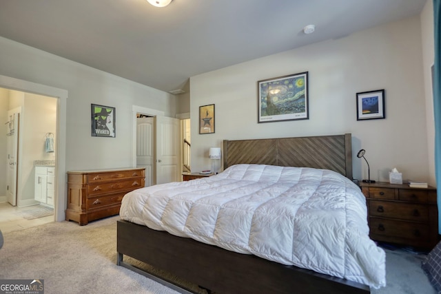 carpeted bedroom featuring connected bathroom