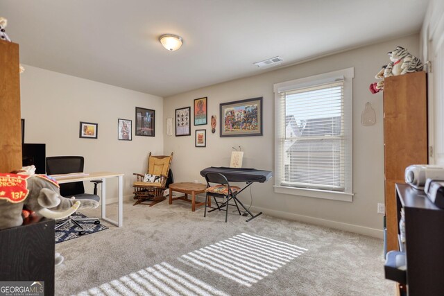 office area featuring light colored carpet