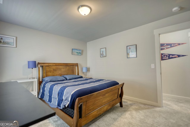 bedroom featuring light carpet