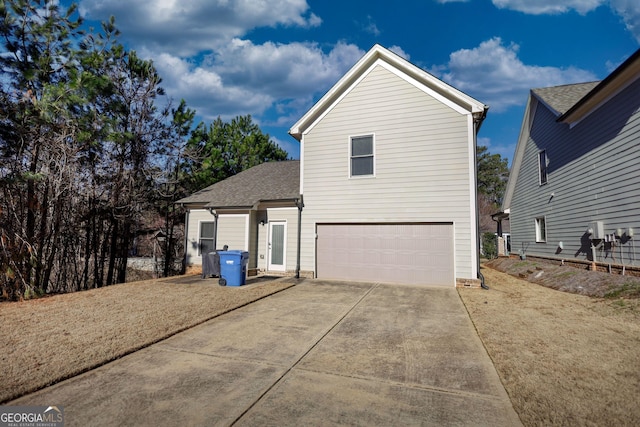 view of side of property featuring a garage