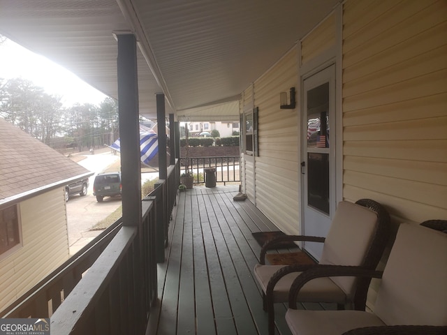 wooden deck featuring covered porch