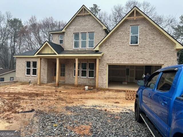 craftsman-style house with a garage and a porch