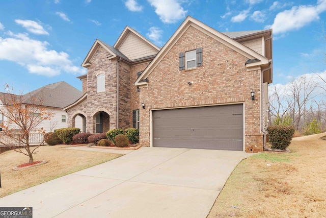 view of front of home with a garage and a front lawn