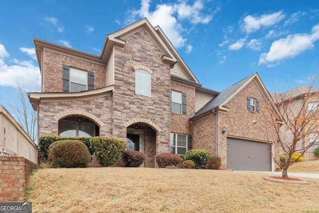 front facade with a garage and a front lawn