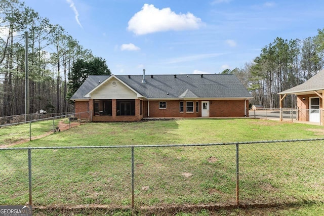 rear view of property with a yard