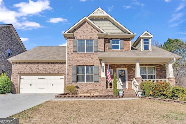 craftsman-style house featuring a garage, a front lawn, and a porch