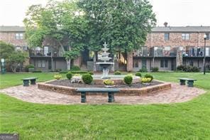 view of home's community with a lawn