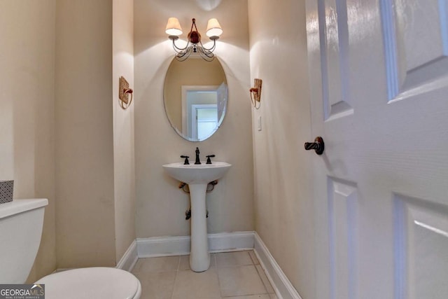 bathroom with tile patterned floors and toilet