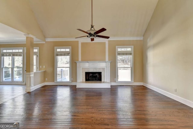 unfurnished living room with lofted ceiling, a wealth of natural light, and a fireplace