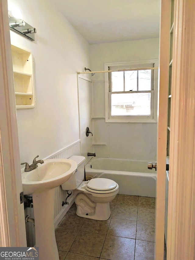 full bathroom featuring tile patterned flooring, sink, bathtub / shower combination, and toilet