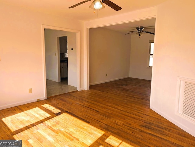 unfurnished room featuring wood-type flooring and ceiling fan