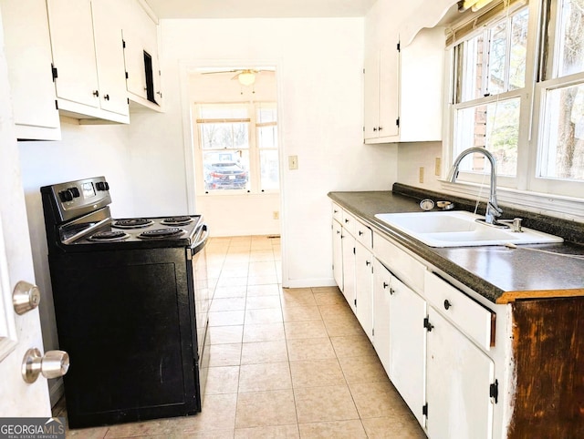 kitchen with sink, ceiling fan, black range with electric stovetop, white cabinets, and light tile patterned flooring