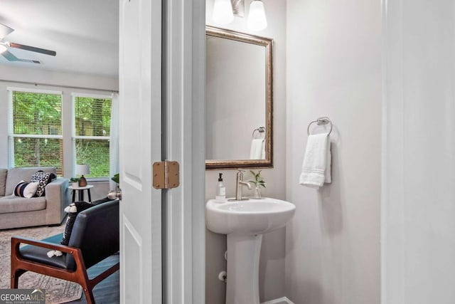 bathroom with a ceiling fan