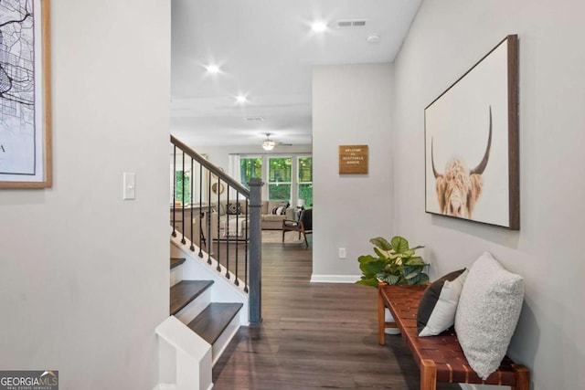 hall with baseboards, visible vents, stairway, wood finished floors, and recessed lighting