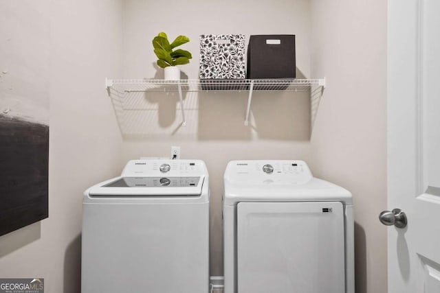 clothes washing area featuring laundry area and independent washer and dryer