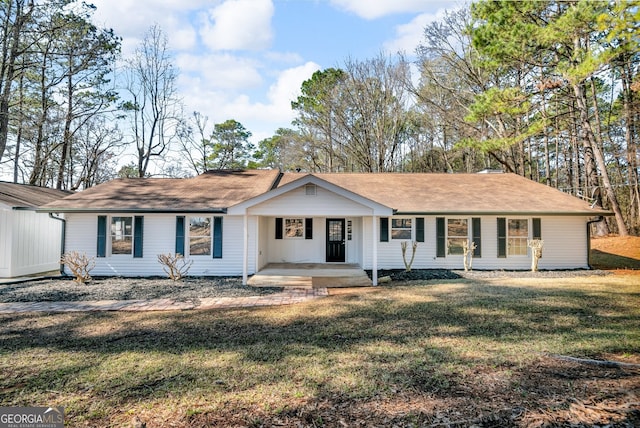 ranch-style home with a porch and a front lawn