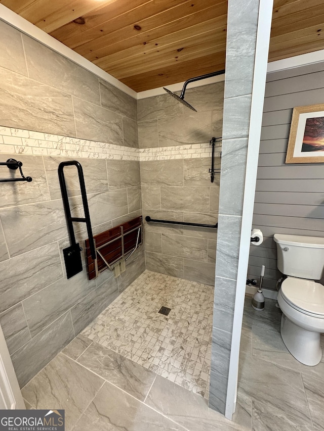 bathroom featuring tiled shower, wood ceiling, and toilet