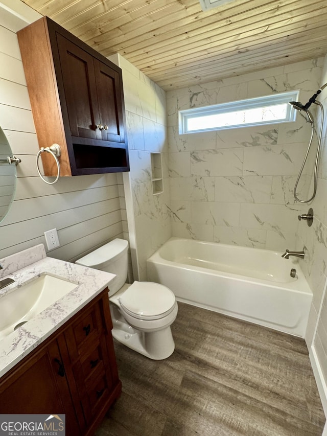 full bathroom with toilet, wood ceiling, tiled shower / bath, vanity, and hardwood / wood-style flooring