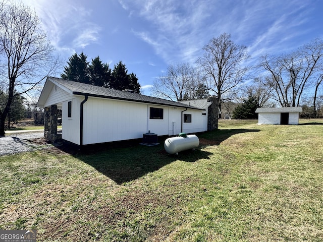 exterior space with a shed and a lawn