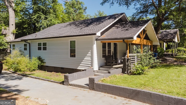 view of front of house with a front lawn and a porch