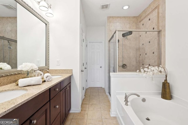 bathroom with tile patterned flooring, vanity, and separate shower and tub