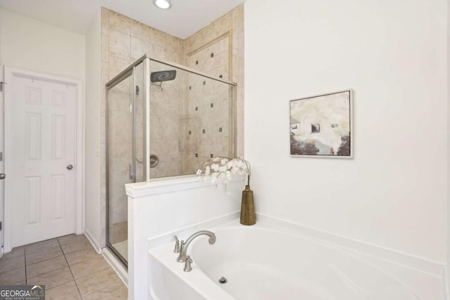 bathroom featuring tile patterned flooring and plus walk in shower