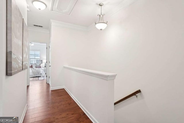 hall with crown molding and dark hardwood / wood-style flooring