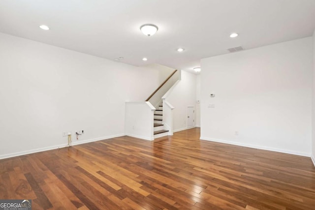 unfurnished living room with hardwood / wood-style floors