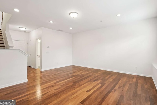 empty room featuring wood-type flooring