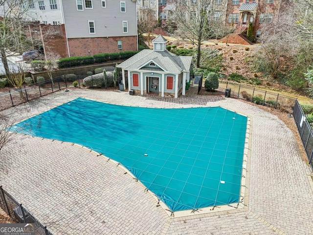 view of pool featuring an outbuilding