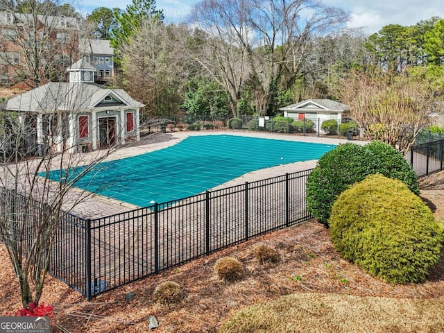 view of swimming pool with a patio area