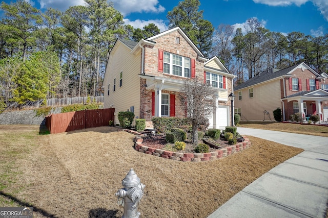 view of front of home featuring a garage and a front lawn