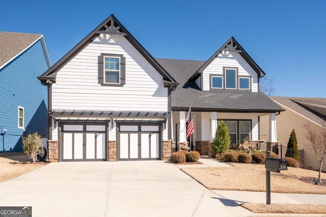 view of front of property with a garage and a porch