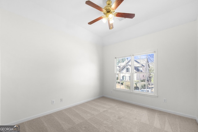 unfurnished room featuring light carpet and ceiling fan