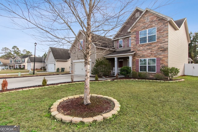 view of front of property with a garage and a front yard