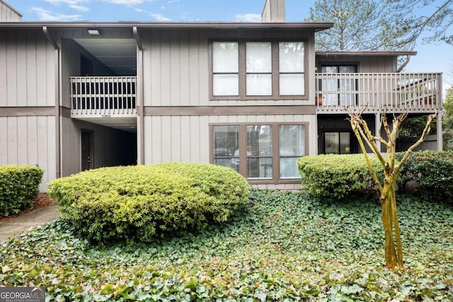 back of property featuring a balcony